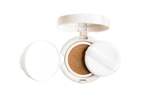 Foundation cushion powder with puff. Cosmetic face powder isolated on white background.
