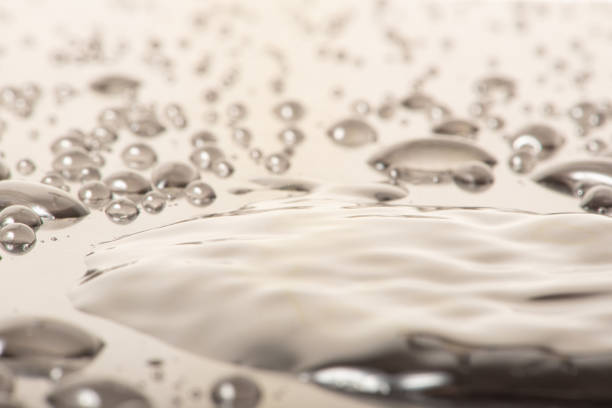 Macro water drops, macro photo of water drops on a reflective surface, selective focus.