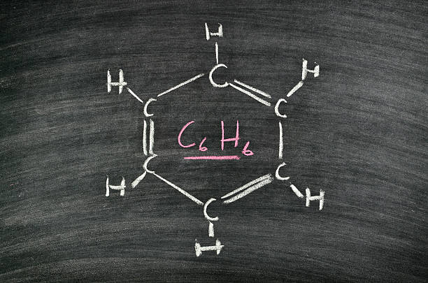 molecule structure of Benzene, aromatic hydrocarbon written on blackboard