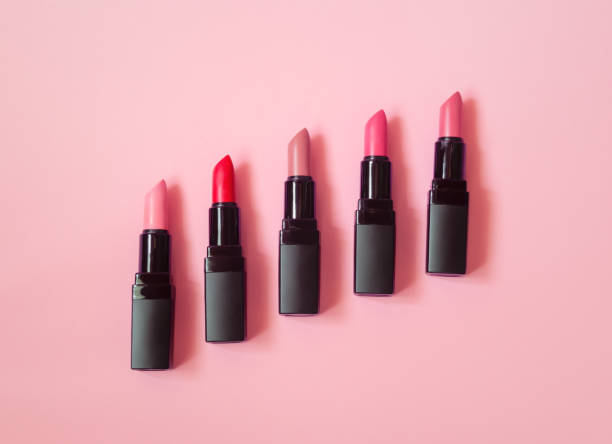 Set of beautiful lipsticks on pink background. View with copy space.
