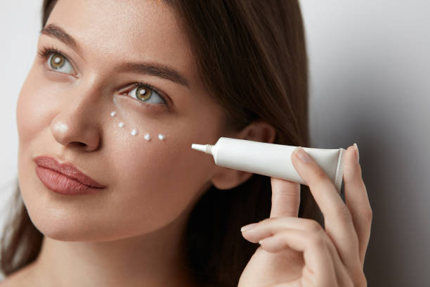 Eye Skin Care. Beautiful Woman Applying Eye Cream On Skin Under Eyes. High Quality